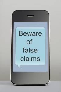 Mobile phone with scam message speech bubble